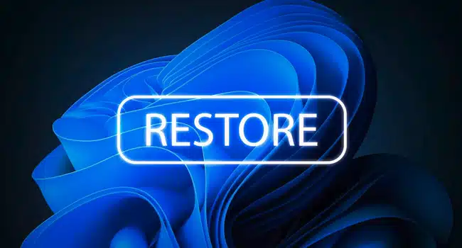 تصویر پس زمینه ویندوز 11 که بر روی آن عبارت Restore نوشته شده است